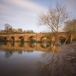 A photography of Farndon Bridge, which crosses the River Dee and the England-Wales border